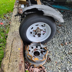 A dolly tire blowout destroyed the tire, rim, fender, and also damaged my car.