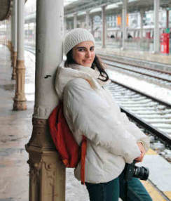 A camera and a small backpack are all you need to travel the world