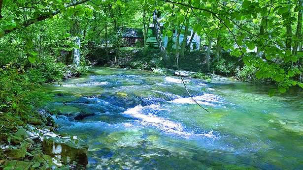 Camping beside a cold mountain river